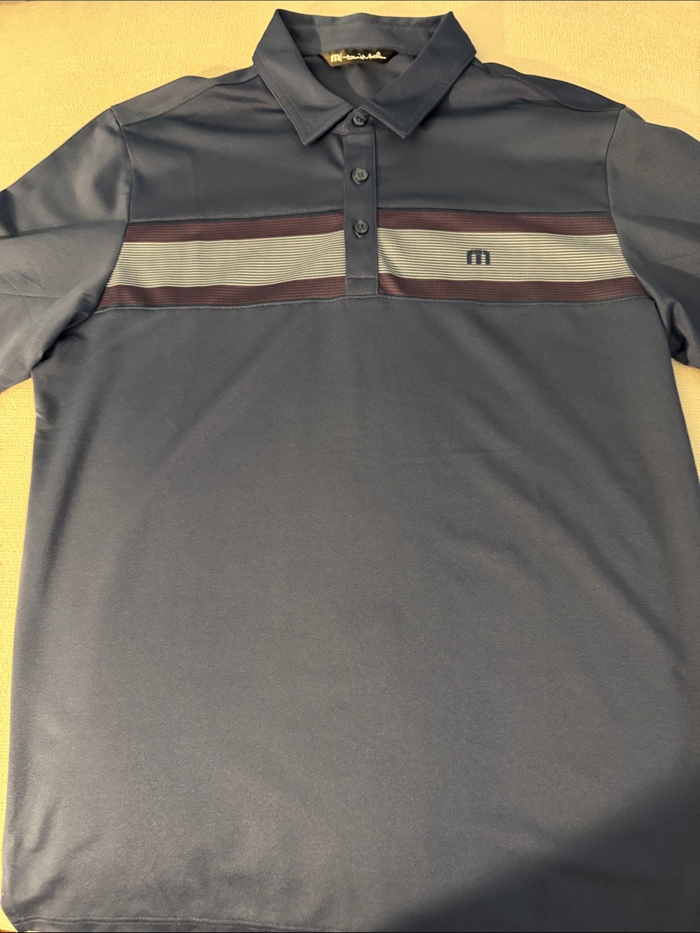 NWOT Travis Mathew Navy Polo with Burgundy and Light Gray Chest Stripe
